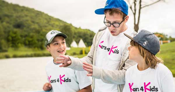 3 boys wearing Kars4Kids t shirts